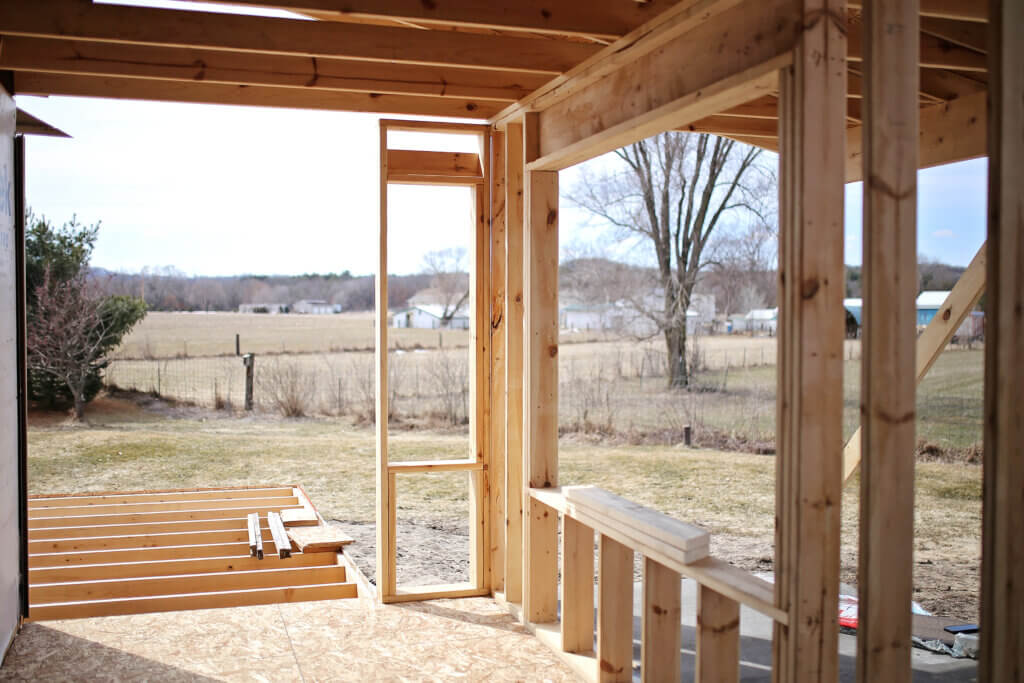 View of a doorway of 2x4 wood framing of a new construction addition on a house being built
